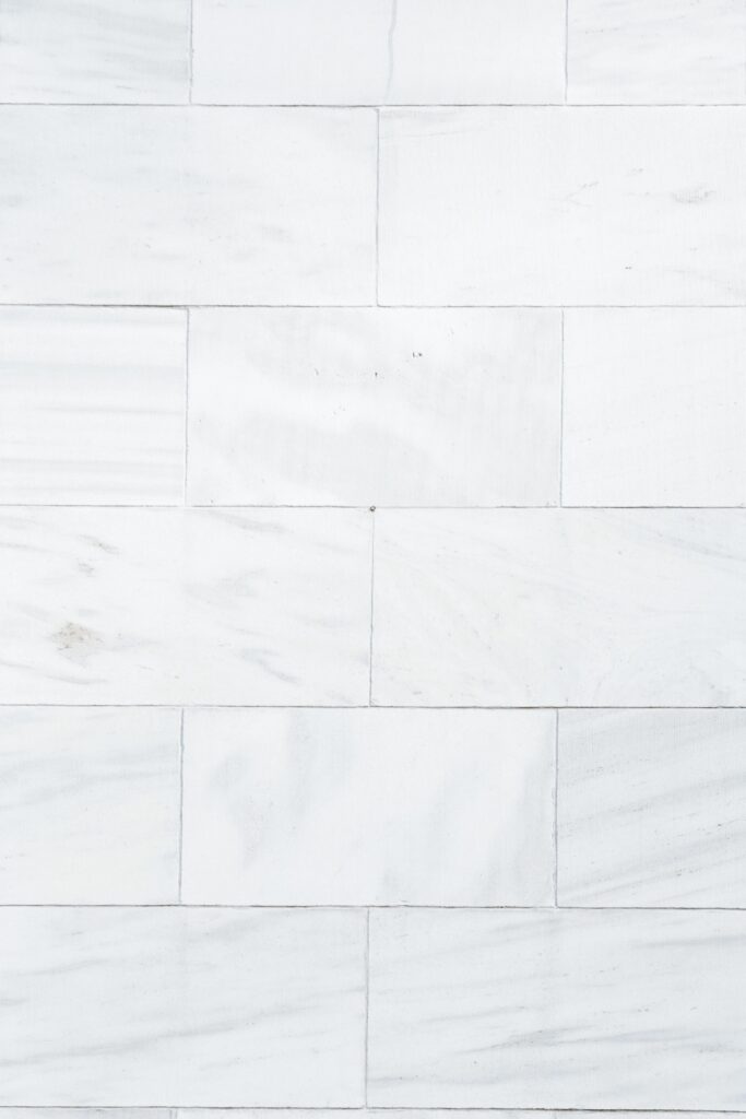 Full frame architecture and home interior textured background of white marble tiled wall pattern